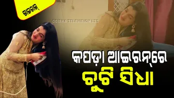 Girl straightening hair with dress irons goes viral