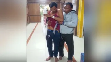 man reaches in hospital with severe palm injury 