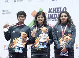 Pratyasa Ray (center) poses with her gold medal at KIUG