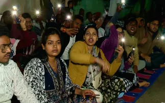 OSSC LTR Arts-Odia aspirants hold overnight protest by using mobile flashlights in Bhubaneswar