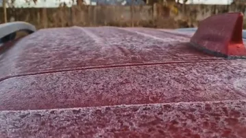 Car covered in frost in Koida