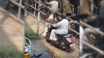 Watch brave grandmother forced scooty rider off  pedestrian path