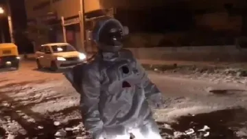 Man dressed as astronaut 'moonwalks' on Bengaluru potholes