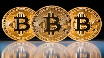 Bitcoin surges above $14,000 to new high