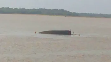 Overloaded boat capsizes, passengers swim to safety