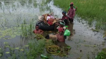 Inflatable Tube Used To Ferry Body Across Marooned Village In Odisha