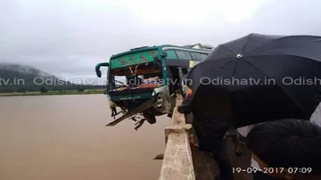 Providential escape for 50 passengers as bus skids to hang from Bridge