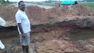 National Highway cut to drain out water from Sujata Nagar in Puri