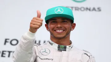 Hamilton claims pole position in Malaysia as Vettel to start from last