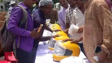 Free Helmets To Offenders, Roses For Law-Abiding Persons
