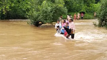 No Bridge, Villagers Cross Overflowing Canal On Foot In Odisha’s Keonjhar