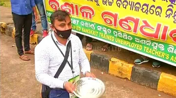 Teachers In Odisha Kneel Down In Streets With Begging Bowls To Protest Unemployment
