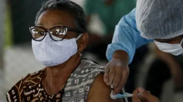 A man receives a dose of COVID-19 vaccine at Paulista Avenue in Sao Paulo, Brazil on July 25, 2021. 