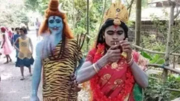 People Dressed As 'Lord Shiva', 'Parvati' Smoking