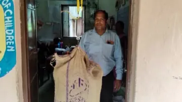 Rice bags being measured in a school