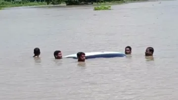 Flood havoc in Odisha: Temple submergence, car recovery to cooking on roof, dramatic visuals capture