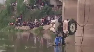 15 missing as tractor falls into pond