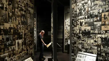 A visitor watches an exhibition