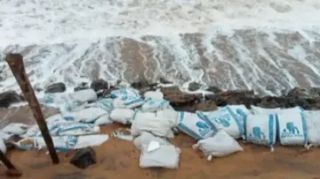 Guard wall on Puri-Konark Marine Drive Road washed away 