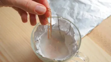 Silver jewels soaked in baking powder solution