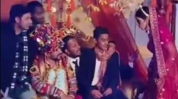 Groom’s friends occupy wedding throne, watch how bride reacts