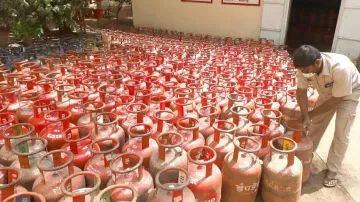 Workers arranging the domestic LPG cylinders at a distributor unit