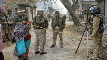 Delhi Police personnel stand guard near the residence of the deceased woman of Kanjhawala incident, 