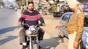 Cops left speechless after intercepting Royal Enfield biker without helmet, watch
