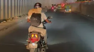 Bengaluru man carries pet cats on his back while riding bike; video goes viral