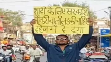 Youth stands in the middle of road seeking wife with a govt job