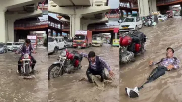 Youth lies down on waterlogged busy road after parking Royal Enfield, watch