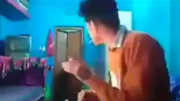 Teen caught smoking by Indian mom, watch what happens next while escaping