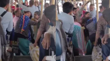 Woman and young girl fight over seat in bus