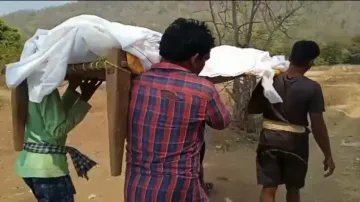 Villagers carry relative’s body on cot in Kandhamal