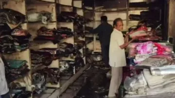 Shops reduced to ashes after massive fire at Laxmi Marker Complex