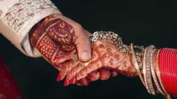 Groom embarrasses bride on wedding stage 
