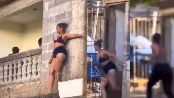 Woman chases husband’s girlfriend in innerwear on streets, watch