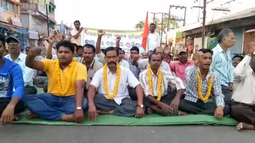 Mangalam Timber workers sit on NH-26 demanding reopening of unit