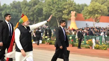 Breaking protocol again, PM Modi walks on Rajpath