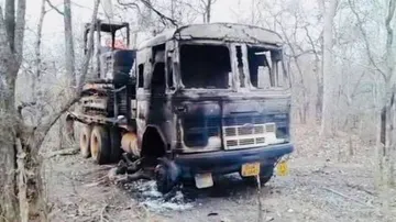 Naxals set afire four vehicles & machines at road work site
