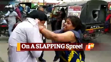 High Drama In Sambalpur, Woman Thrashes Husband On Busy Street
