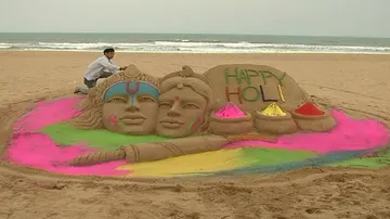Radha-Krushna sand sculpture by Manas Sahu for Holi