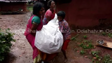 Ostracised, woman buries husband's body with help of JCB!