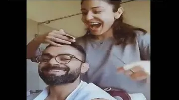 Anushka turns barber for hubby & captain Virat Kohli: Watch video