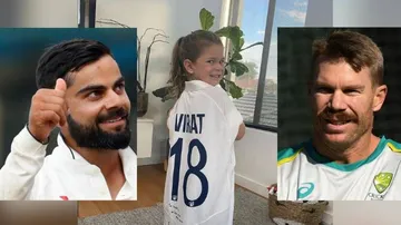 David Warner's Daughter Poses With Kohli's Autographed Test Jersey