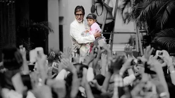 'Reluctant' Aaradhya greets Sunday well-wishers with Big B