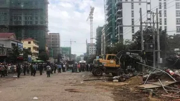 3 dead, dozens trapped as building collapses in Cambodia