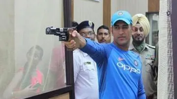 Dhoni hones shooting skills after India practice wash out