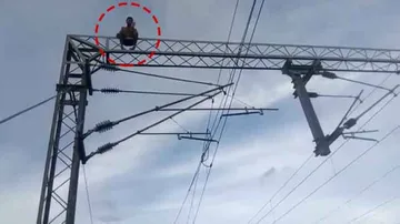 Man climbs atop electric tower at railway station; rescued