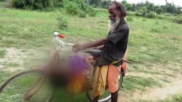Ostracised man in Odisha carries relative's dead body on bicycle